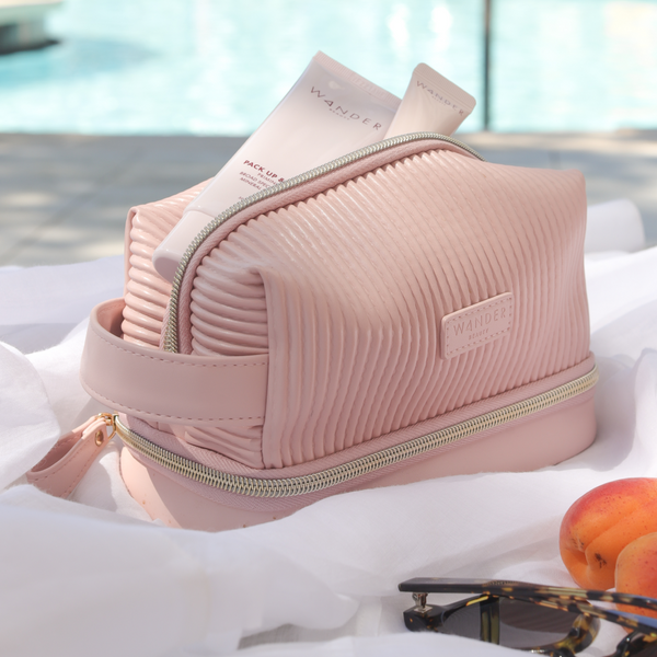 Pink Wander Beauty Makeup Bag with Makeup and Skincare Products inside