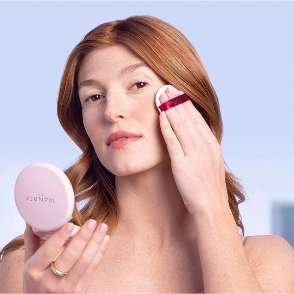 Model Applying Wander Beauty's Wanderlust Powder Foundation