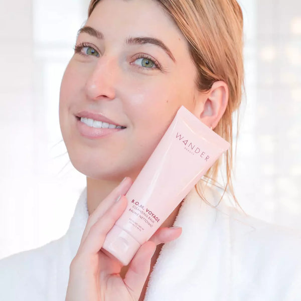 Model Holding Wander Beauty B.O.M. Voyage Cleansing Balm