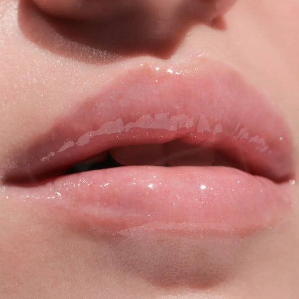 Up Close of Models Lips with Pink Lip Gloss on