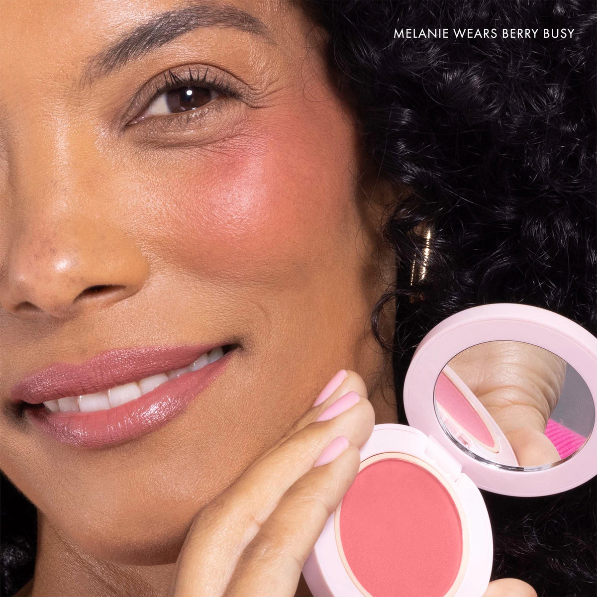 Model wearing Blush All Day Hydrating Powder Blush in Berry Busy