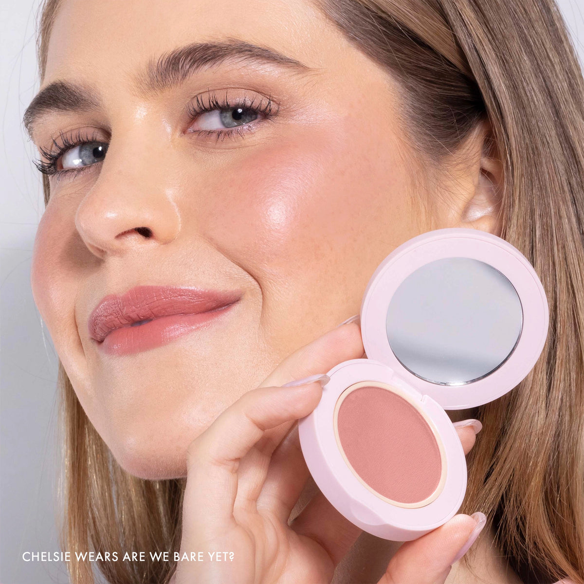 Model wearing Blush All Day Hydrating Powder Blush in Are We Bare Yet?