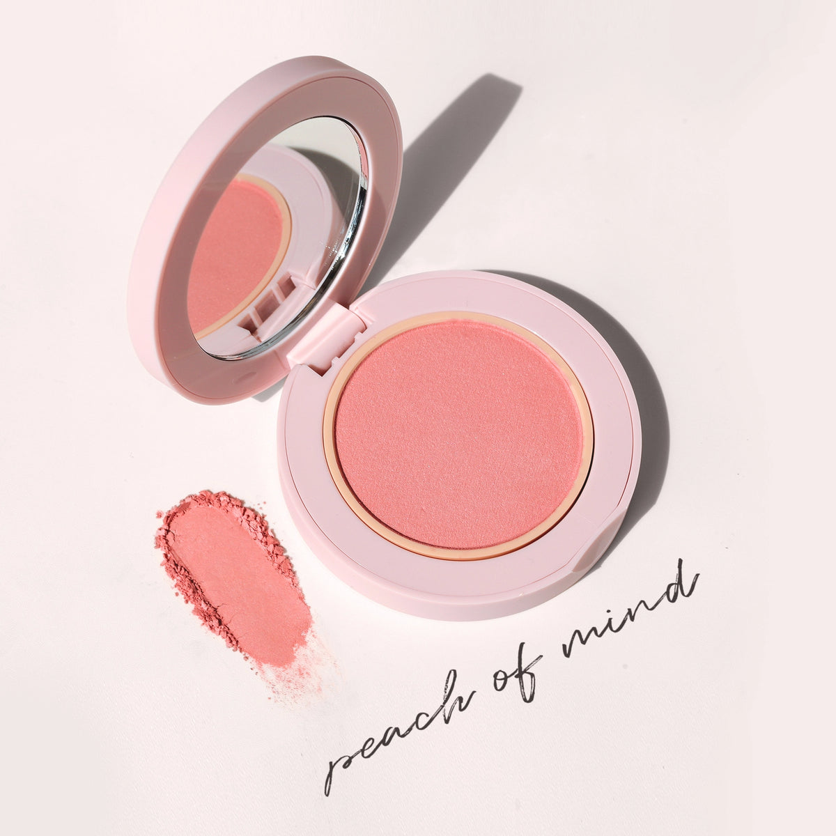 Close-up of Blush All Day Hydrating Powder Blush in Peach of Mind texture