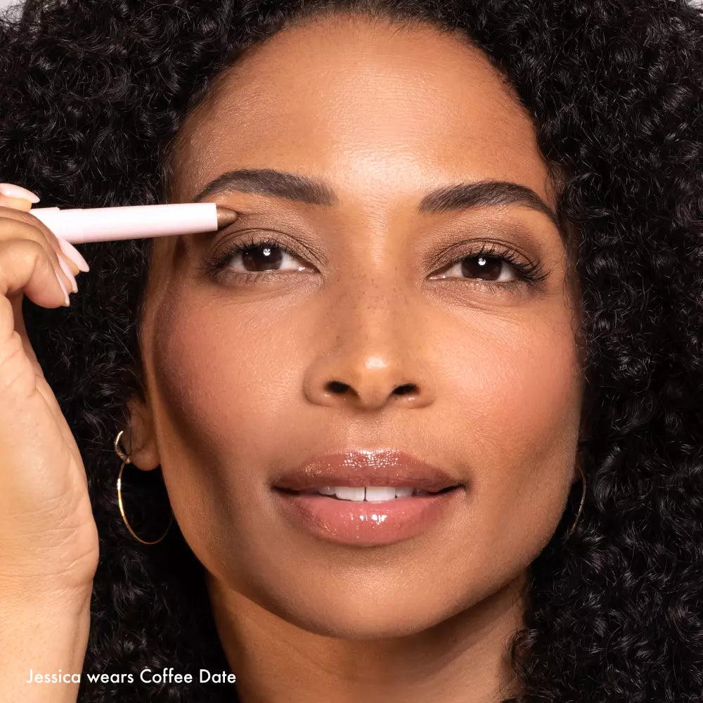 Model wearing Wandering Eyes Shadow Stick in Coffee Date