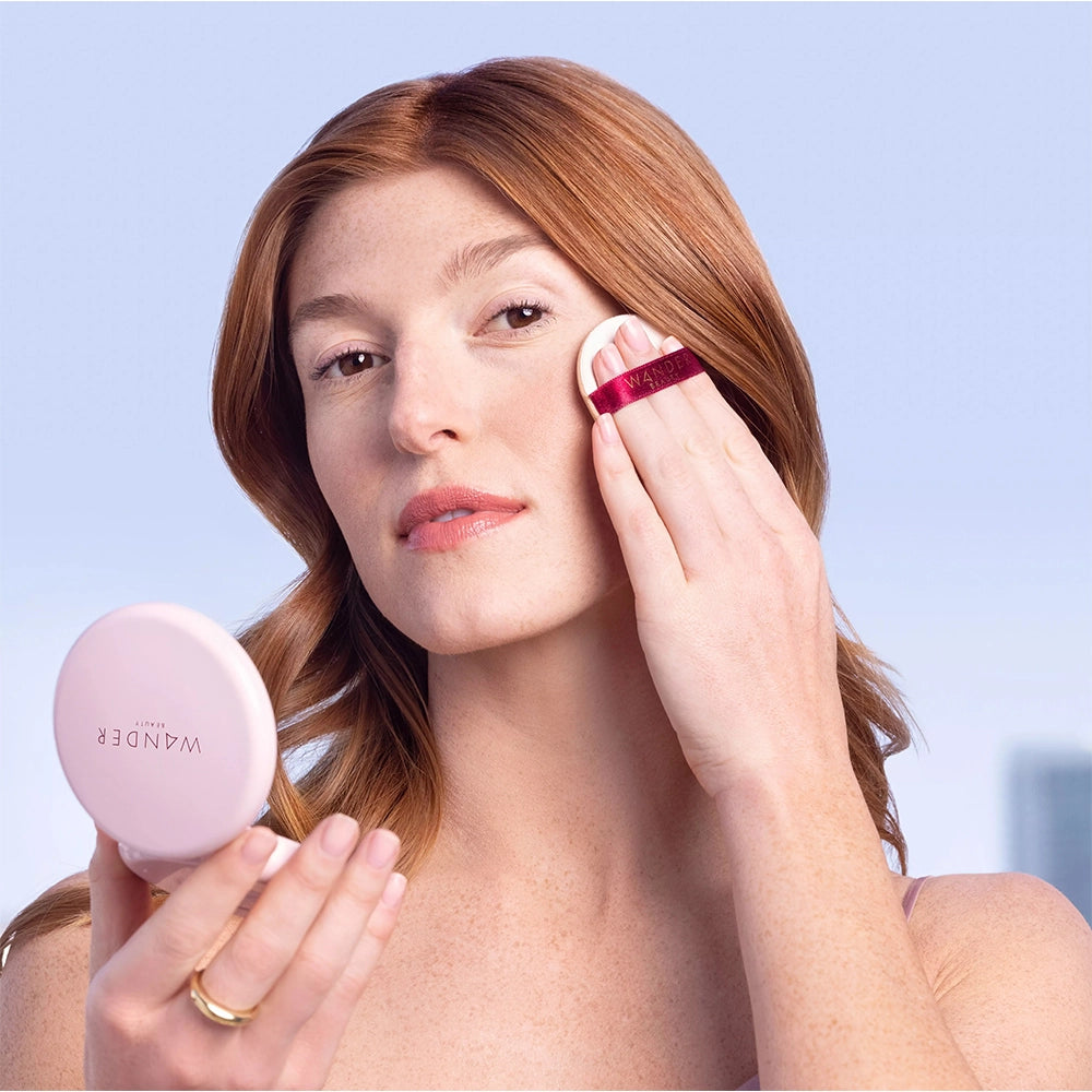 Kate applying wanderlust powder foundation