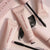 A couple of Wander Beauty Upgraded Lashes™ Treatment Mascara with its wands and swatch of formula